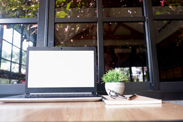 Cropped shot view of white office desk table with the office equipments, alcohol sanitizer, face mask and other office supplies on the modern space, flat lay.work at home.