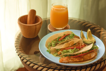 healthy and delicious dish of chicken with lettuce, chili, souce and tortilla