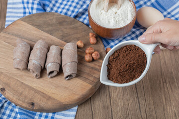 Cocoa mutaki cookies on a wooden board with cinnamon powder