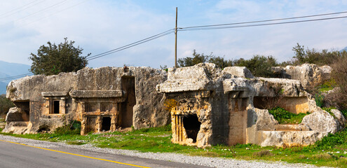 Remains of stone cut tombs in ancient Araxa city in Lycia, currently in Oren village near Fethiye,...