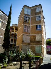 Building in a popular residential area, next to a small park