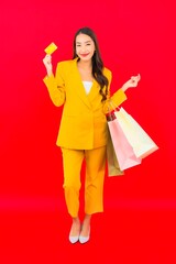 Portrait beautiful young asian woman with a lot of shopping bag