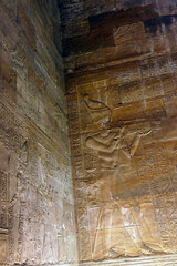 Ancient carvings of pharaohs, Egyptian gods and hieroglyphics