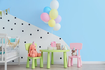 Interior of children's room decorated for first birthday party