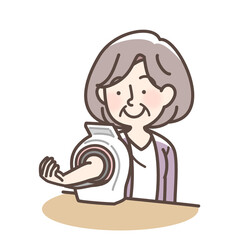 血圧をはかるおばあさん　上腕式測定機