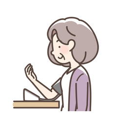 血圧をはかるおばあさん　上腕式測定機