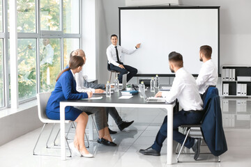 Fototapeta premium Businessman giving presentation during meeting in office