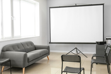 Room with projector prepared for conference in office