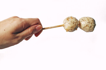 Japanese oden 2 black pepper fish ball, chicken meatball, isolated white meatball delicious yummy fish ball on stick seafood street food
