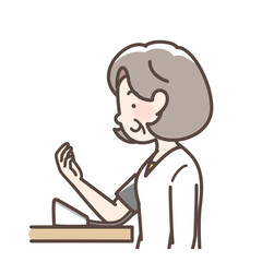 血圧をはかるおばあさん　上腕式測定機