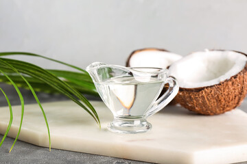 Gravy boat of coconut oil on table