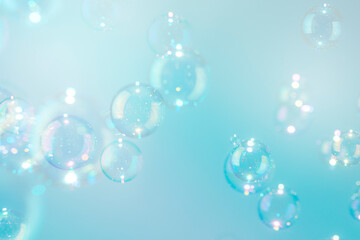 Beautiful colorful transparent shiny soap bubbles background.