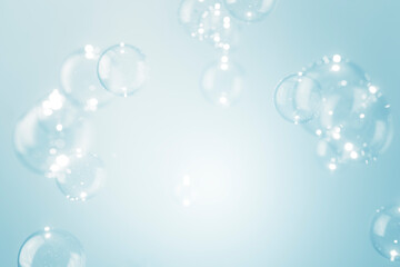 Beautiful shiny transparent soap bubbles float background with copy space.