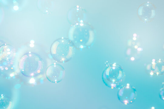 Beautiful colorful transparent shiny soap bubbles background.