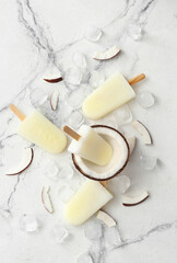 Tasty coconut ice cream on light background
