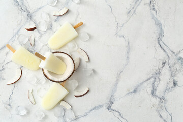Tasty coconut ice cream on light background