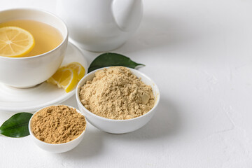 Composition with ginger powder on light background