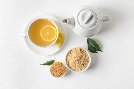 Composition with ginger powder on light background