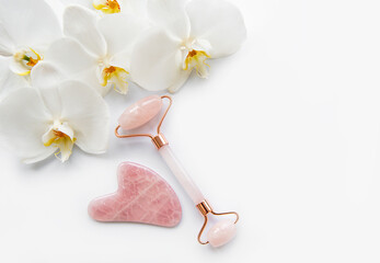 Face massage jade rollers on white background