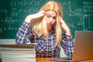 Angry mad student. Knowledge and lesson. Young teacher angry. Student working on a laptop on some...