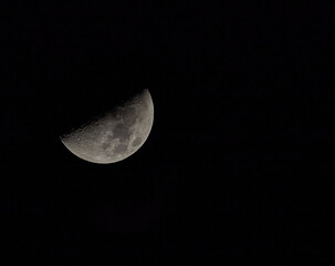 Half moon at night in dark sky
