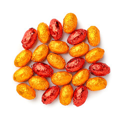 Sweet chocolate eggs on white background