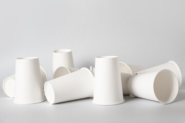 Blank takeaway cups on light background