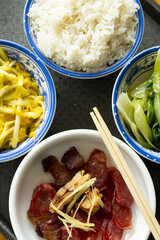 top view fast food of Chinese style sausage and bacon and salty fish with scrambled eggs and hotbed...