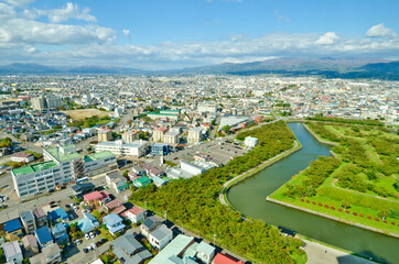 Fototapeta premium Outer moat of goryokaku park and goryokaku Tower in Hakodate, Hokkaido, Japan.