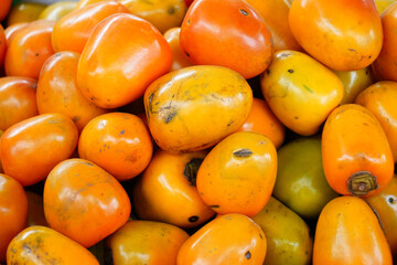 Colorful persimmons in a small market at Vietnam.