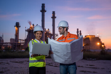 Refinery industry engineer are working and discussing at front oil and gas industrial factory,Oil refinery plant for industry.