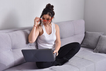 Brunette business woman using laptop