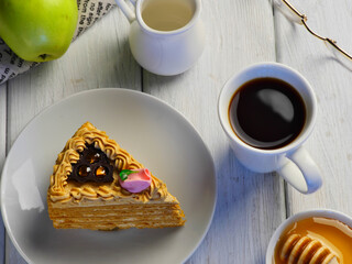 a cup of coffee with a sponge cake