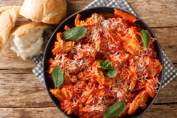 Italian Roman Tripe Trippa alla Romana closeup in the plate on the table. Horizontal top view above