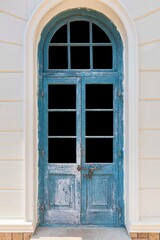 Old vintage blue wood door ,Building entrance and white stone wall
