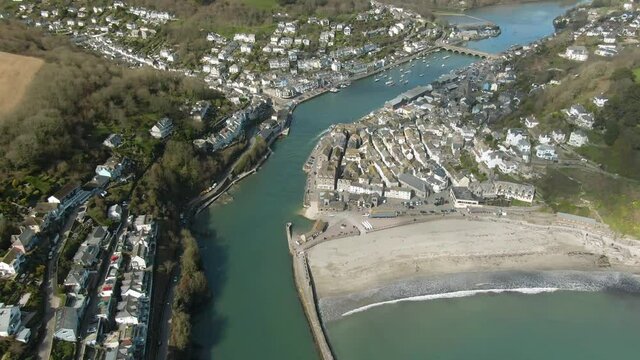 Revealing aerial shot of the historic fishing town of Looe, Cornwall