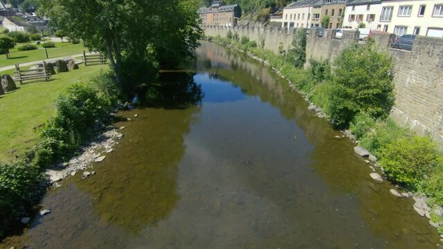 View on a stream through Le parc de rompr&eacute; in La Roche en Ardenne, Ardennes, Belgium, Europe, 4K, 50fps