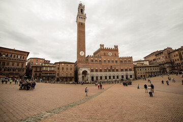 Fototapeta na wymiar View to Siena to campanille Torre del Mangia on piazza del Campo