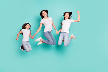 Fototapeta na wymiar Full length body size photo sisters jumping up wearing casual outfits happy overjoyed lottery winners isolated bright blue color background