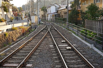 Fototapeta na wymiar Enoden Railway line merging into single line in Enoshima, Kanagawa prefecture, Japan - 江ノ電 複線から単線へ 日本 