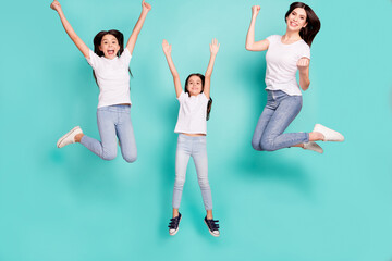 Fototapeta na wymiar Full length body size photo sisters jumping overjoyed won lottery keeping hands up happy funny isolated vivid blue color background