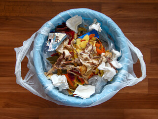 Trash can with chicken leftovers