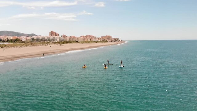 Wide aerial view of kayaks and paddleboarders, Torrox, Malaga, Spain