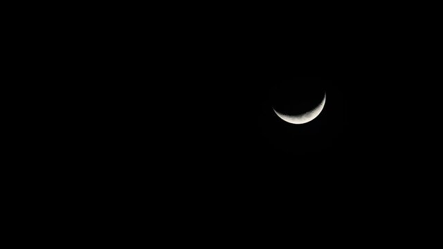 Waxing Crescent Moon, 4K Time Lapse, Descending Moon from the top, going down to the right corner.