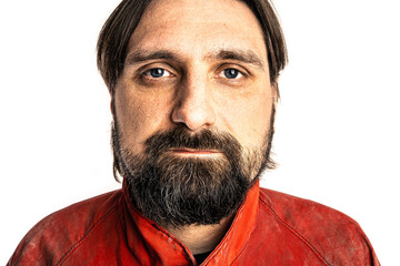 The man wearing a red overalls poses in a photo studio.