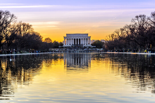 Lincoln Memorial and Reflecting Pool at Sunset in Washington DC, Beautiful Sky Colors. Bare Trees Across the Park	