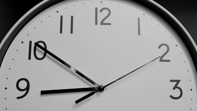 Closeup Wall clock isolated on Black background Showtime 08.45 am, Time lapse 30 minutes 4k braw.
