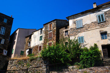 Fototapeta na wymiar View on old houses in Corsican mountain village on a sunny day during summertime with a blue sky