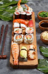 Sushi Set nigiri and sushi rolls on a wooden tray