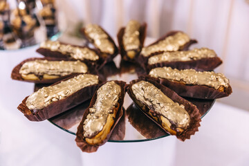 candy bar decorated with delicious sweet fruit muffins, wedding eclairs.
